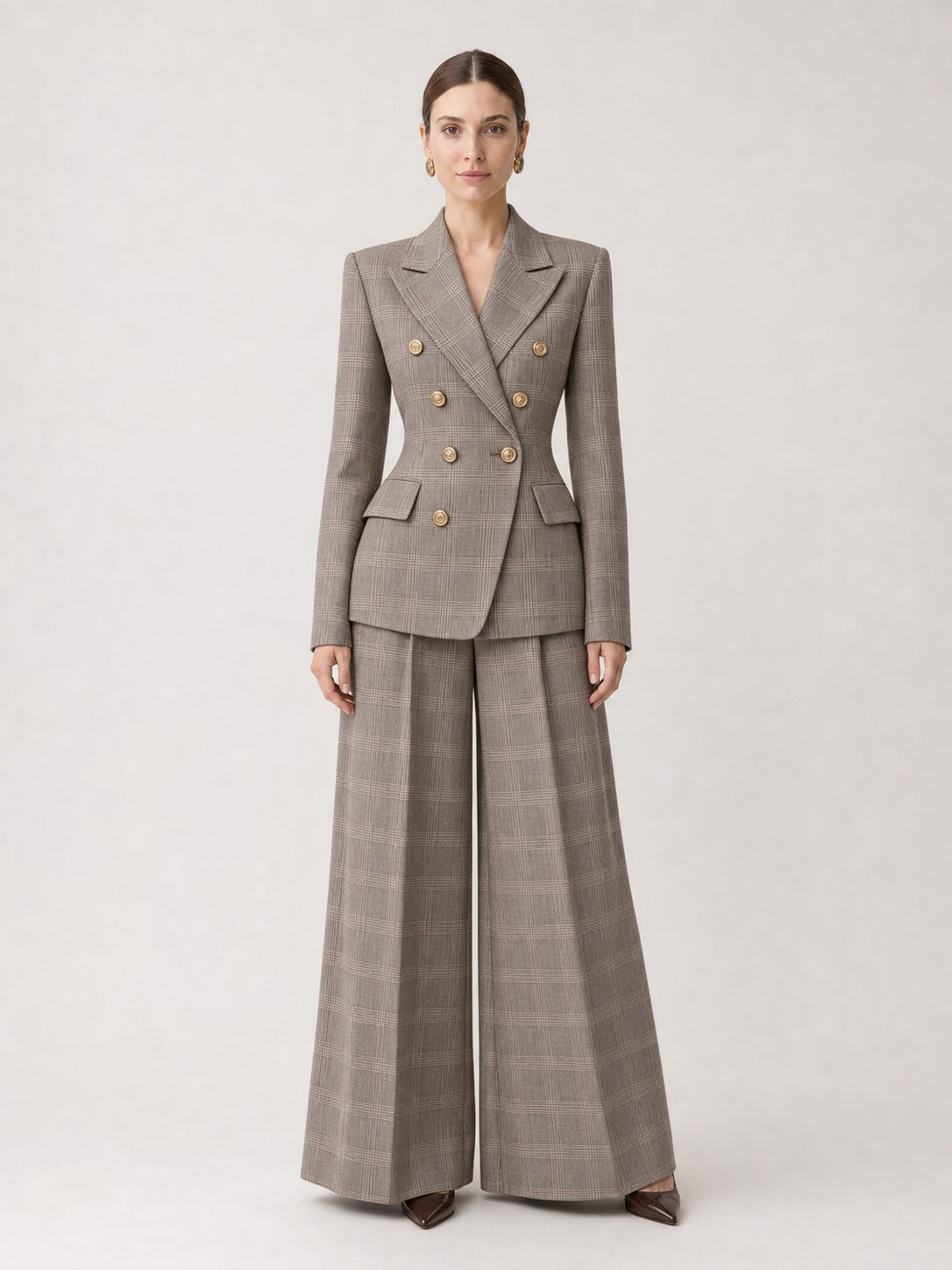 Business lady wearing a BE UP Taupe Plaid Double Breasted Jacket with Gold buttons, Two Piece suit with wide leg trousers.