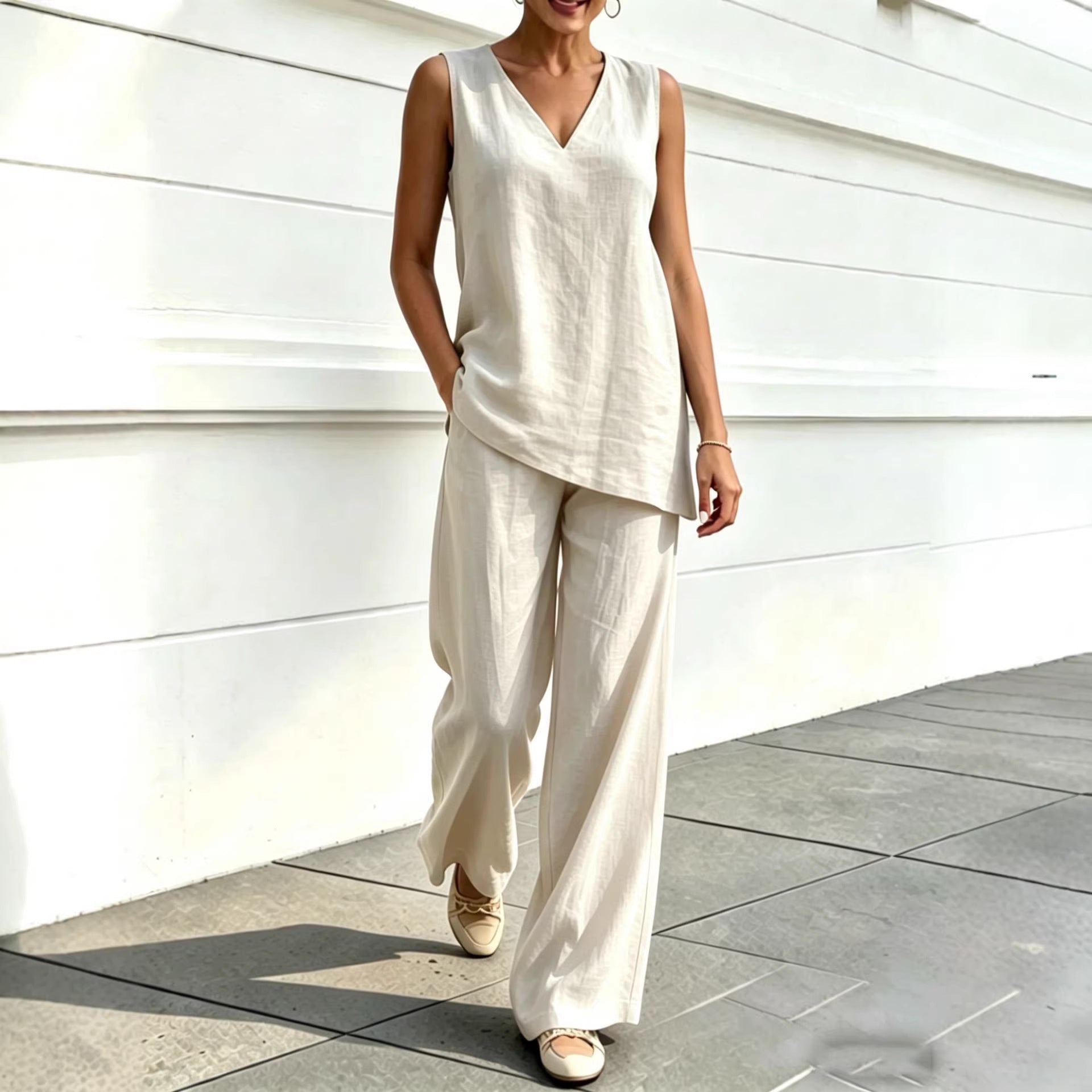 Woman wearing an apricot V-neck sleeveless top and wide-leg pants two-piece set